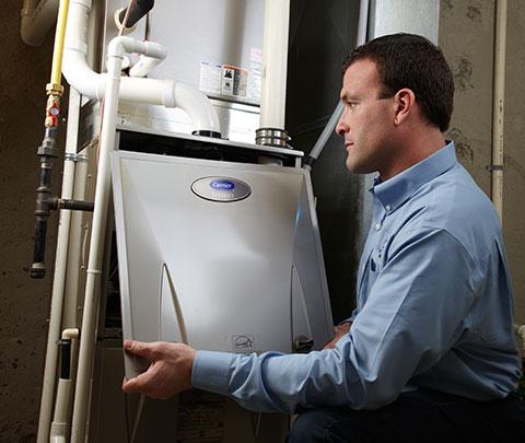 Man finishing up a AC Repair in Eaton County