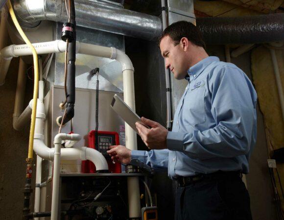 a technician working on HVAC Repair in Lansing, DeWitt, Eaton County, Ingham County, Portland, MI and Surrounding Areas