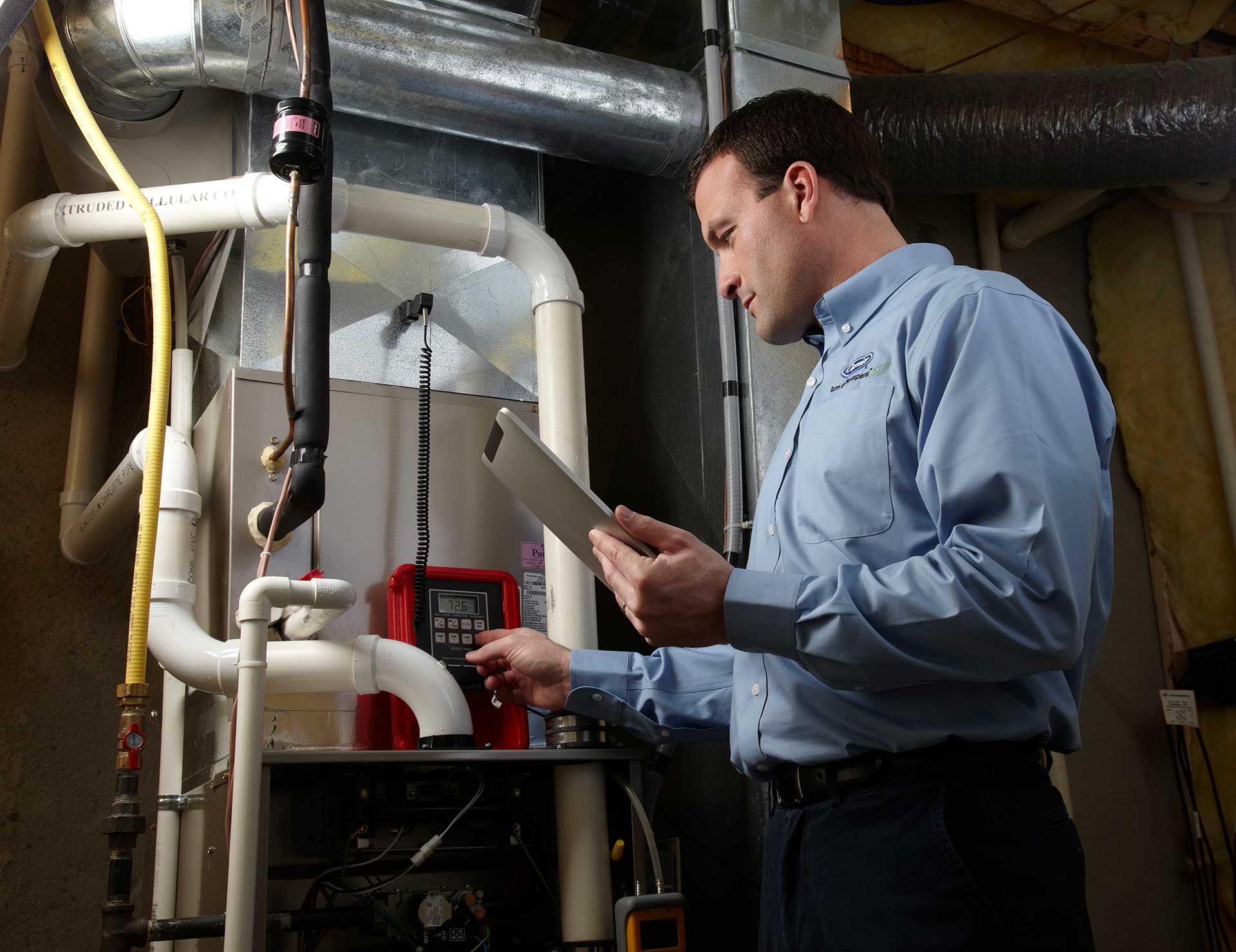 Man Performing Furnace Repair in Eaton County, Lansing, DeWitt, MI, Portland, MI, and Nearby Cities