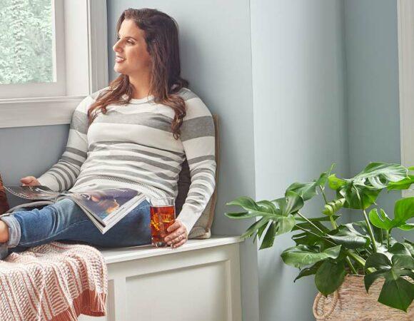 Woman Sitting after HVAC Service in Lansing, DeWitt, Ingham County, Eaton County, Portland, MI & Nearby Cities
