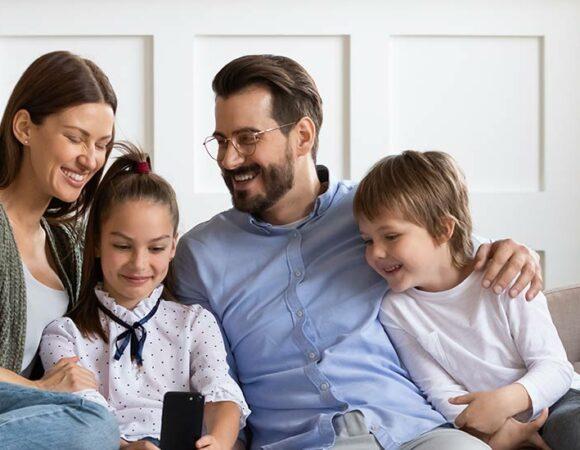 Family sitting after having their Furnace Installation in DeWitt, MI, Lansing, Ingham County, Eaton County & Nearby Cities 